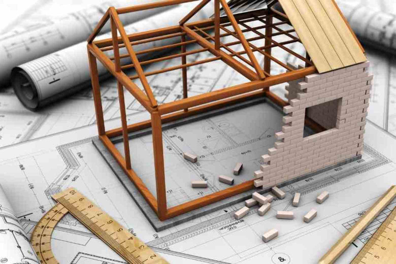 maquette van een huis op een bouwplan